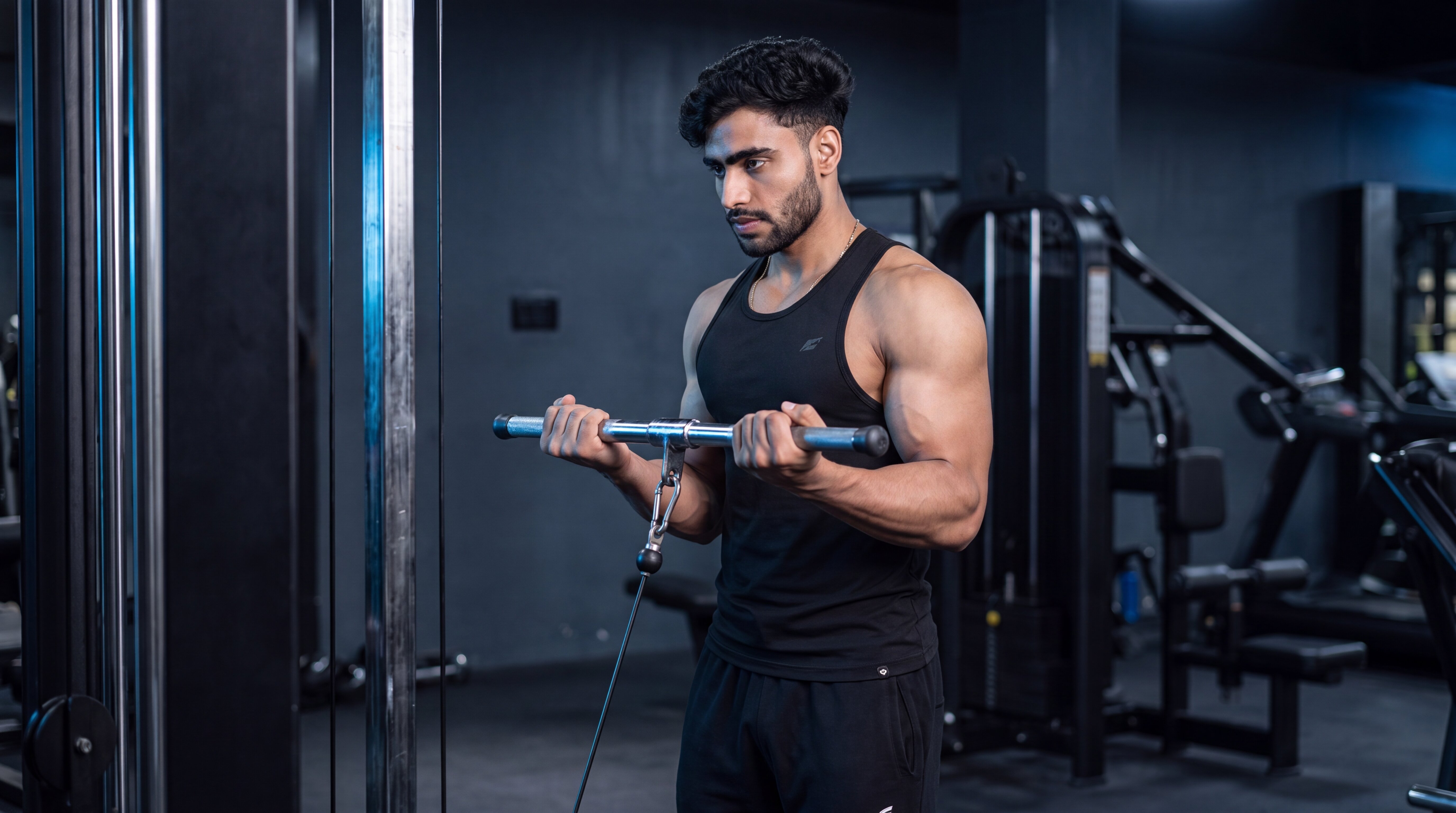 Athlete performing a standing cable biceps curl