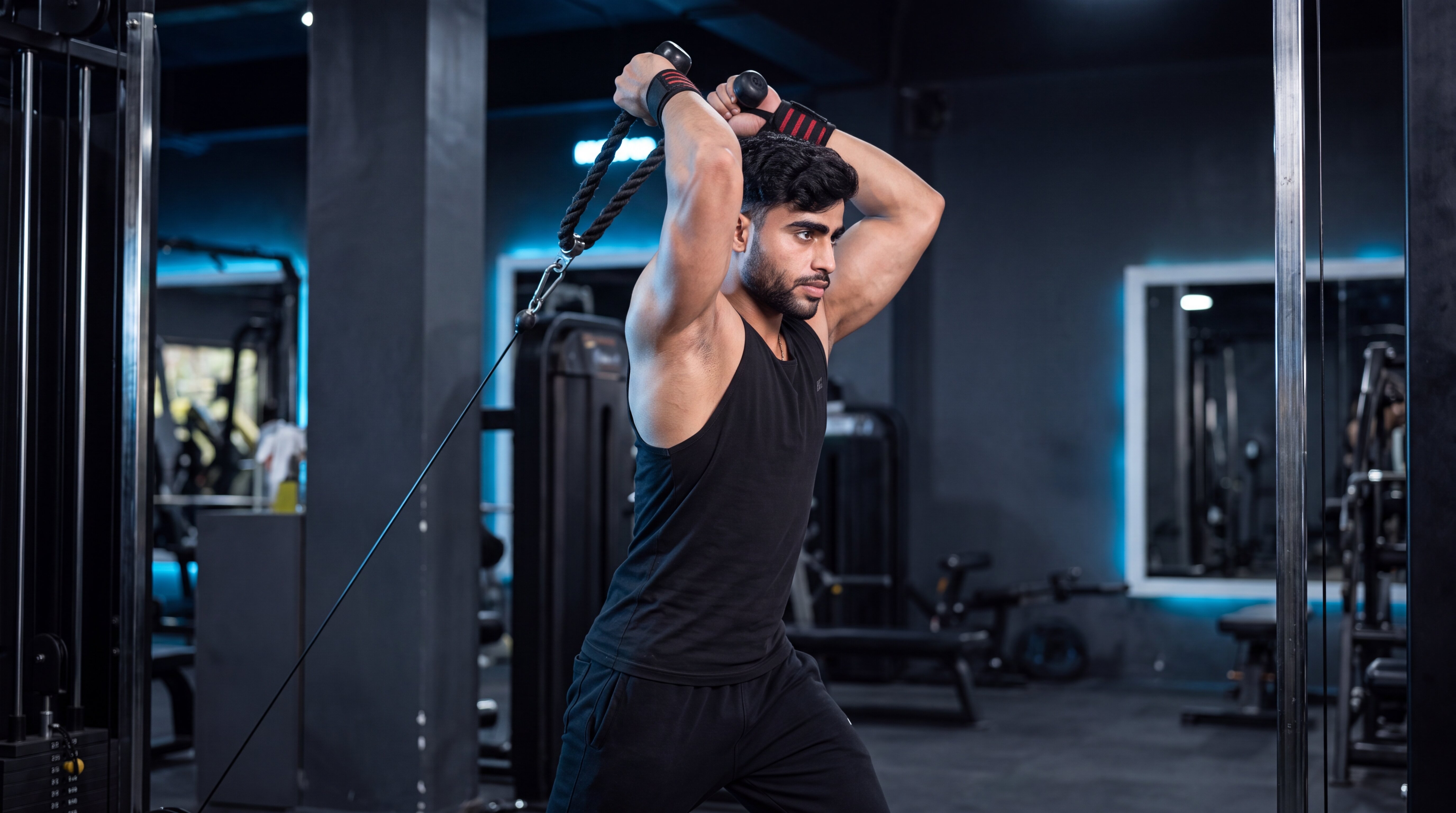 Athlete performing an overhead cable triceps extension